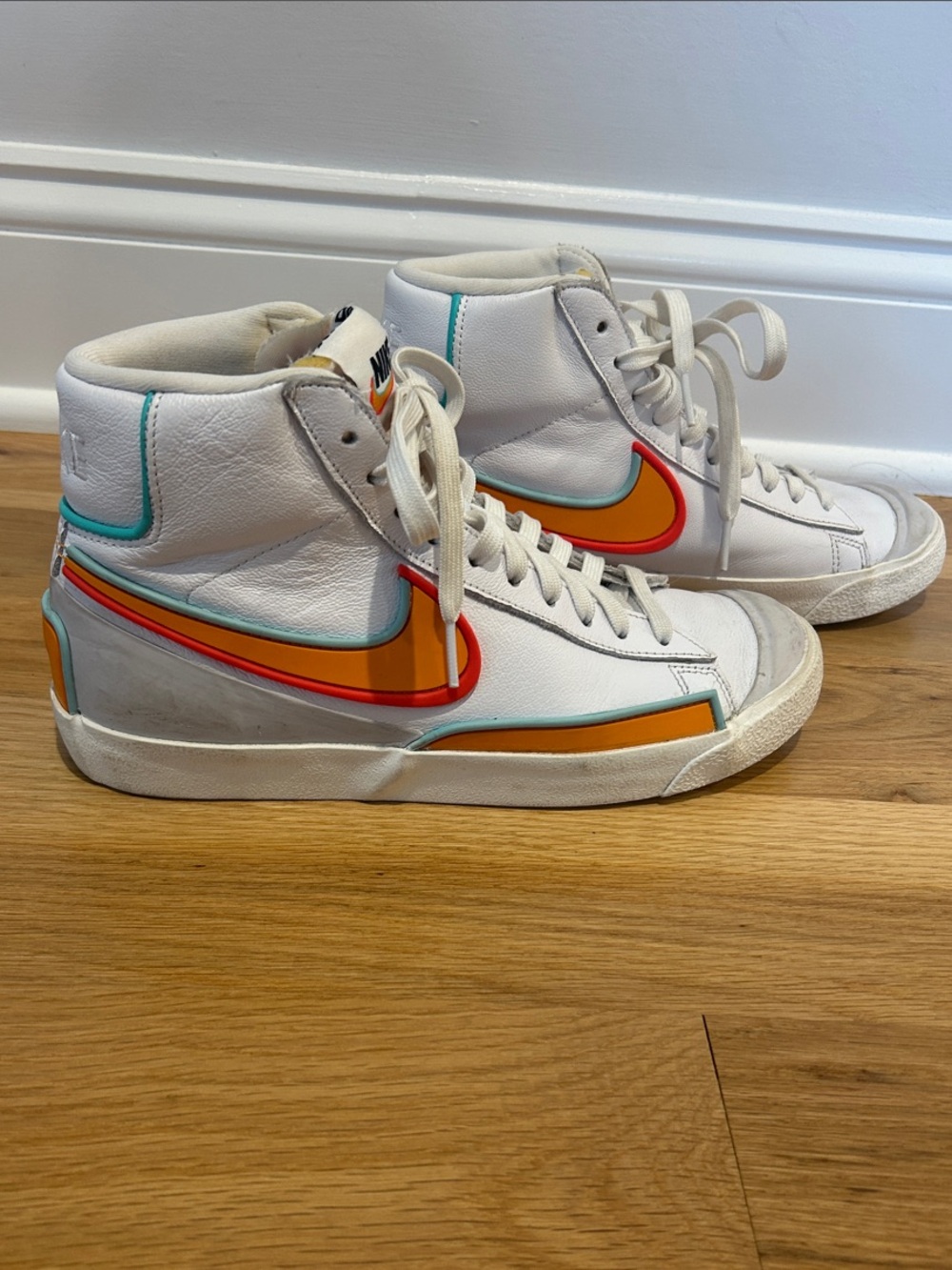 Nike Women White High-Top Sneakers with Orange and Teal Accents